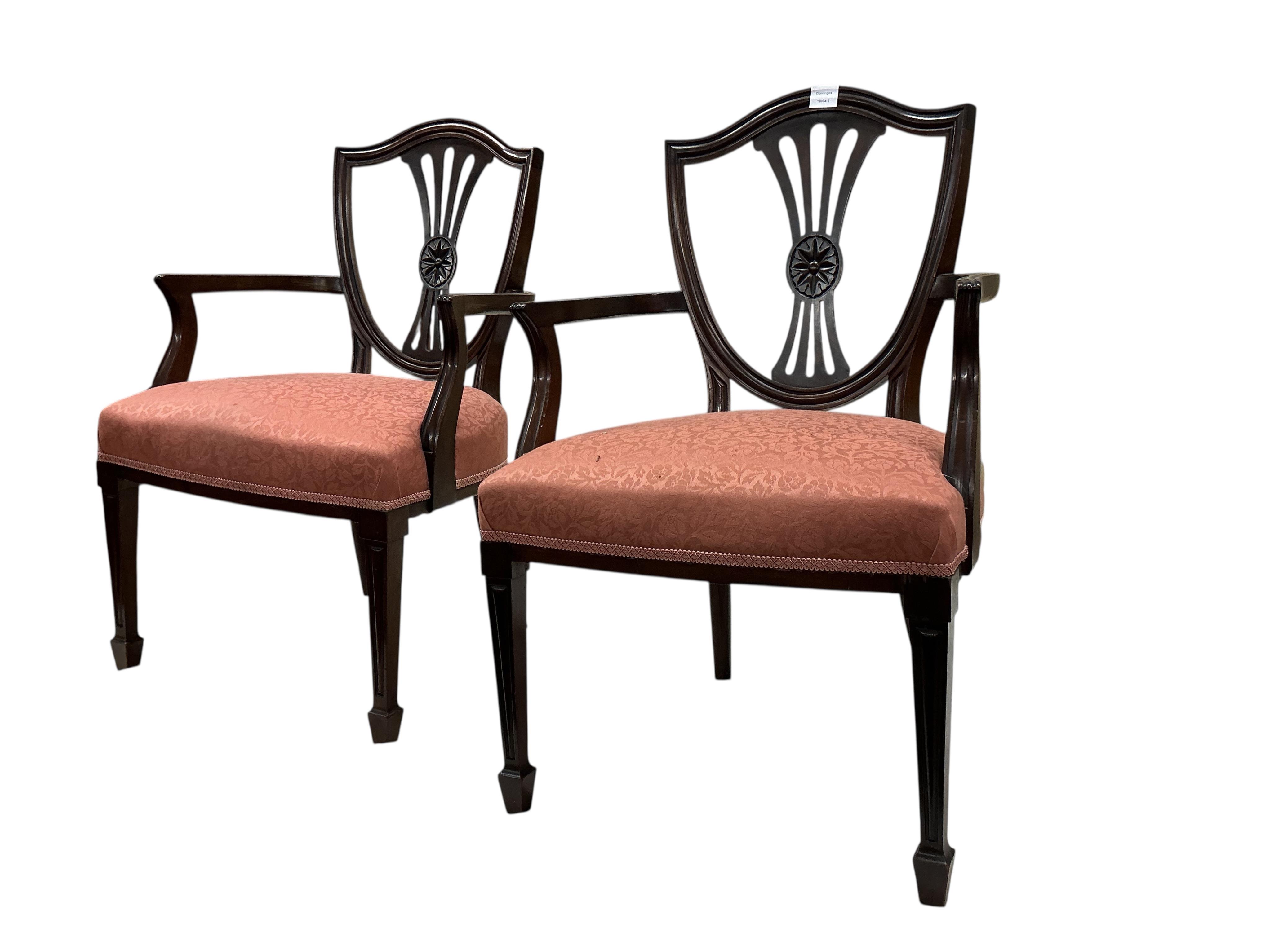 A set of fourteen early 20th century mahogany Sheraton style mahogany dining chairs, two with arms